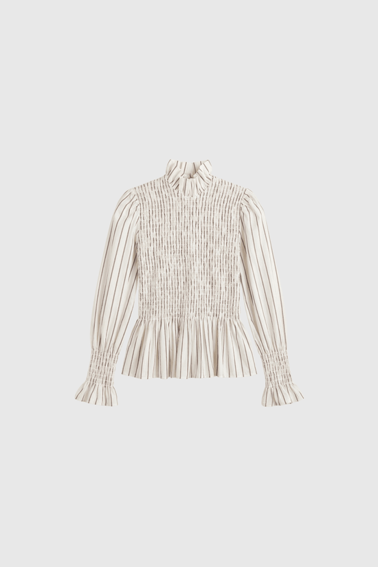 Aleria cream smocked shirt with puffed sleeves, signature feminine silhouette from Maria de la Orden